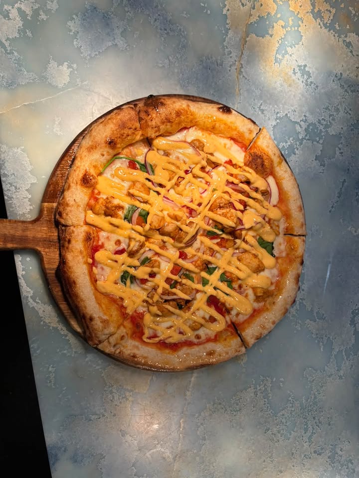 Featured image for “Wood Fired Pizzas Are Back at Tura Beach Country Club”